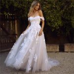 Wedding dress with sleeves off the shoulder